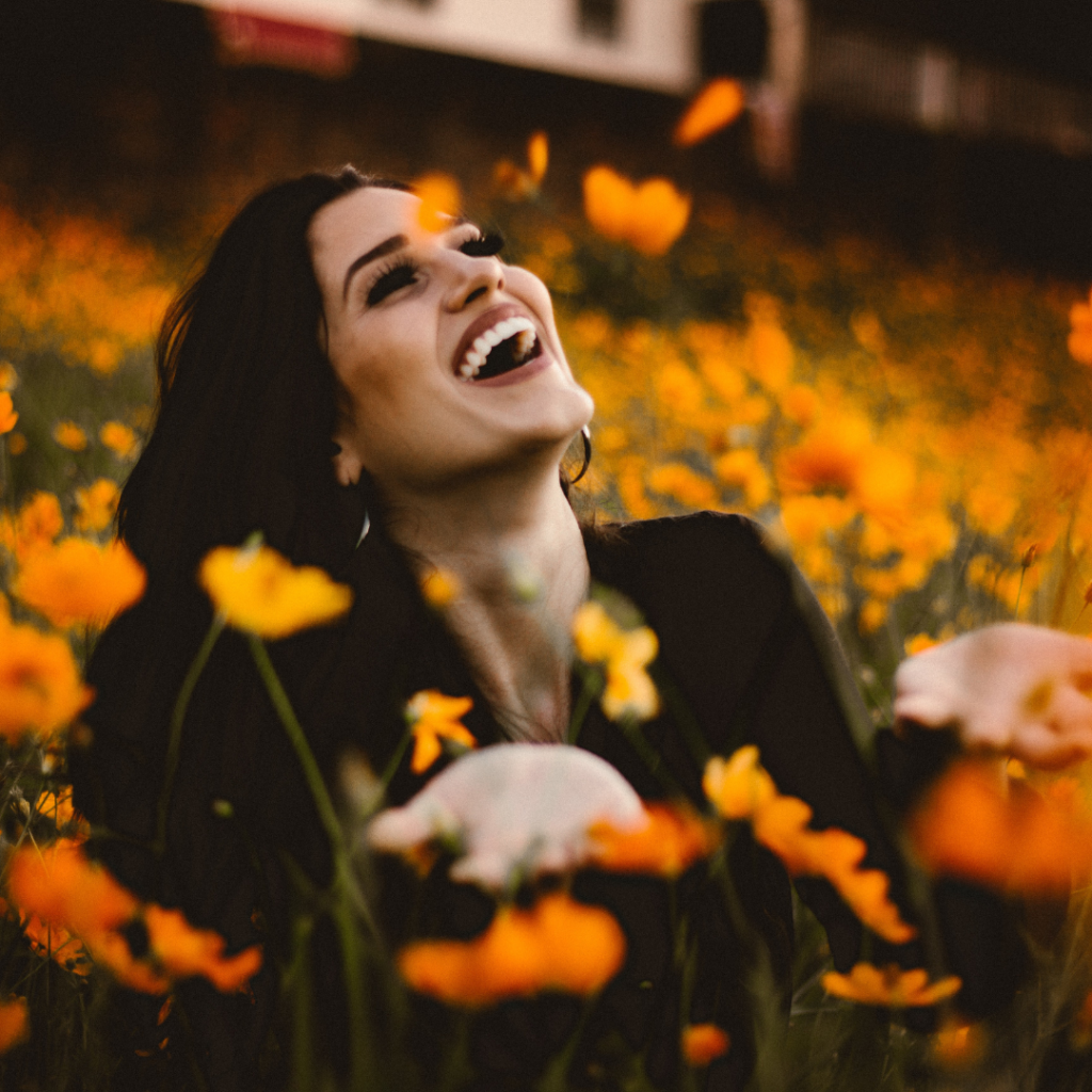 women smiling and displaying a happiness mindset