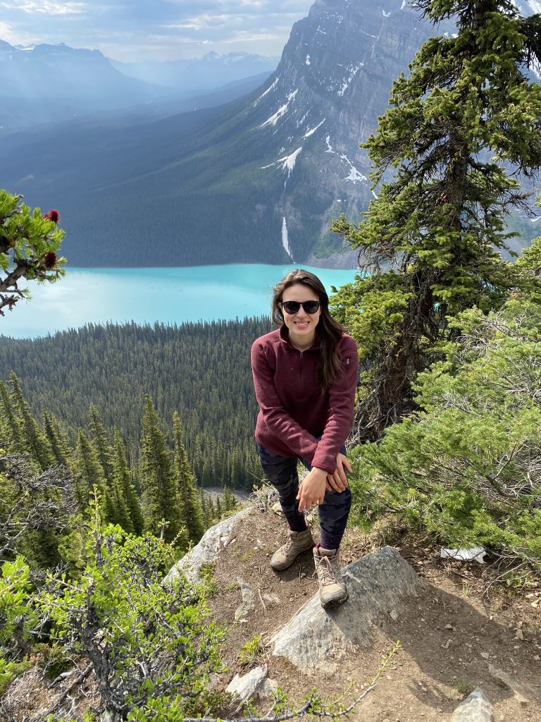 life and business coach ana mcrae helps you figure out how to start an online business and grow your business standing in front of lake louise